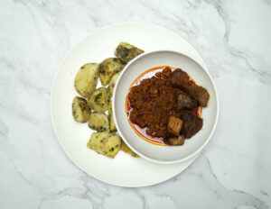 healthy eating with her sweet potatoes and fish stew